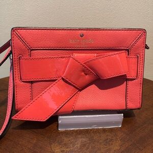 Kate Spade wristlet  pebble leather/patent bow on front  orangeish red gold NWOT